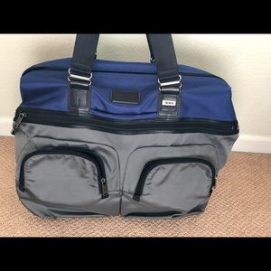 Tumi duffel bag; blue leather, tumi tech waterproof fabric.
